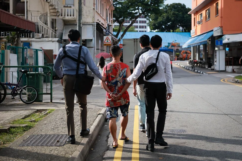 Xiao allegedly handed money to bailors outside the New Cathay Hotel in Geylang.