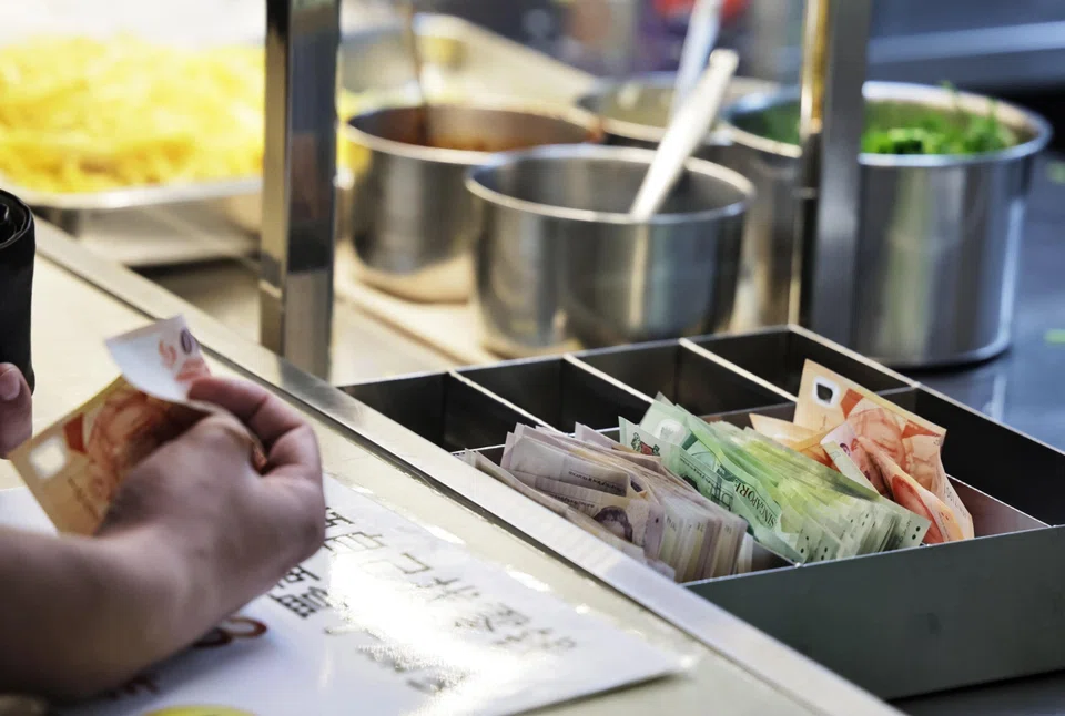 The stall owner of Nanyang Lor Mee at People’s Park Centre accepts only cash. Customers make payment and collect their change from a metal box, all without staff intervention.