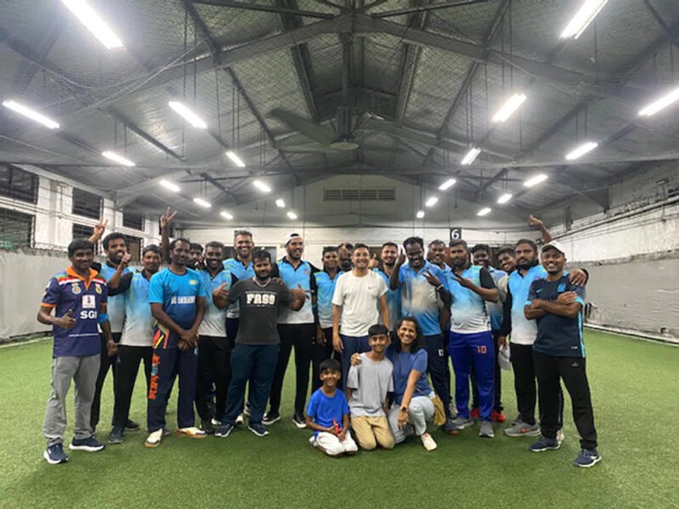 Brothers, age 7 and 10, launch cricket league for migrant workers in Singapore