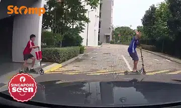 Driver shocked as 2 kids on scooters suddenly dash in front of him in Eunos