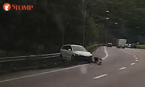 Car sent spinning after skidding and crashing into road barrier on PIE slip road