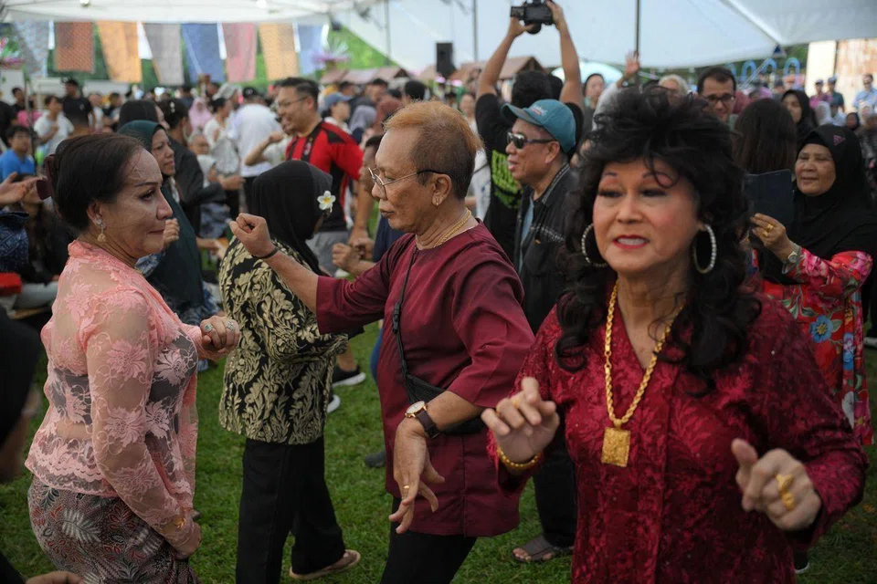 People partaking in Joget Dangkung, a traditional communal dance that has roots in the Riau Archipelago, during Hari Orang Pulau on June 14.