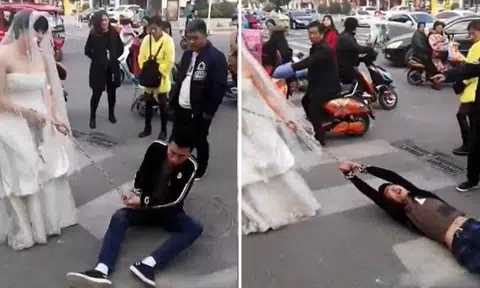 Bride in China drags groom through the streets in chains after he doesn't show up to wedding