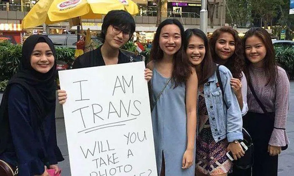 Although Ms Cassandra Thng received some hostile stares while walking around various places with her sign on March 31, the Transgender Day of Visibility, she also found support. About 65 people took photos with her, and three girls prayed that she would have the strength to be herself.PHOTO: CASSANDRA THNG/FACEBOOK
