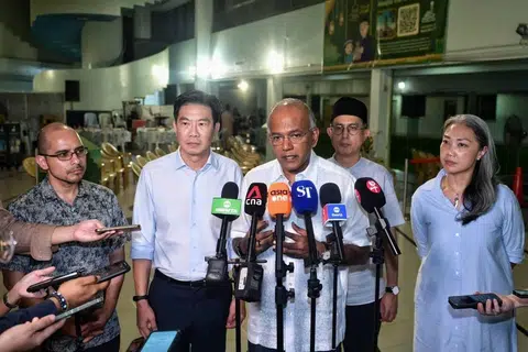 Law and Home Affairs Minister K. Shanmugam (centre), with (from left) former Nominated MP Syed Harun Alhabsyi and Nee Soon GRC MPs Derrick Goh, Muhammad Faishal Ibrahim and Carrie Tan, speaking to the media on March 27.