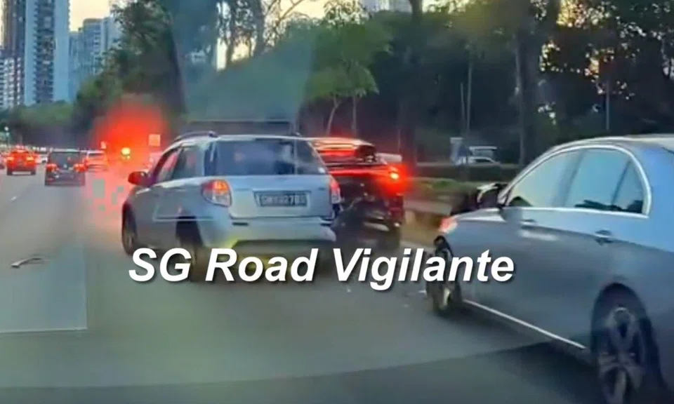 a light grey suzuki car crashes into a black car on the central expressway