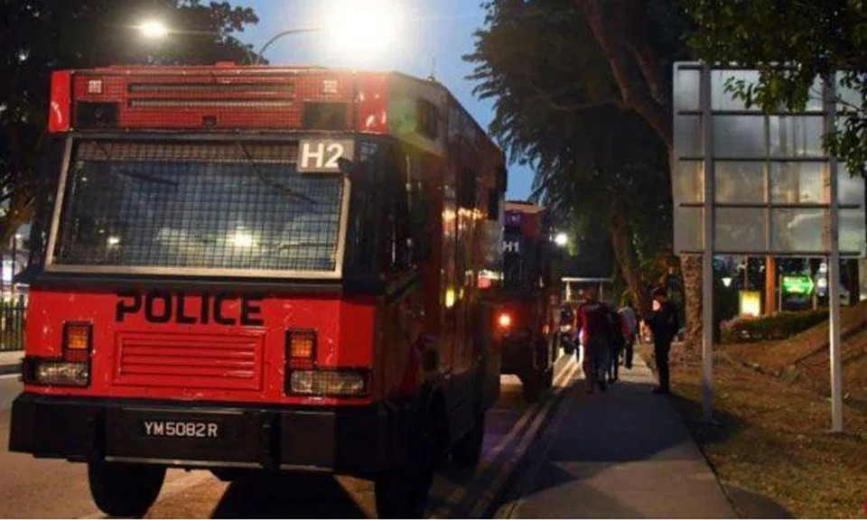 Two anti-riot vehicles were deployed in the search for the 28-year-old man. PHOTO: LIANHE ZAOBAO