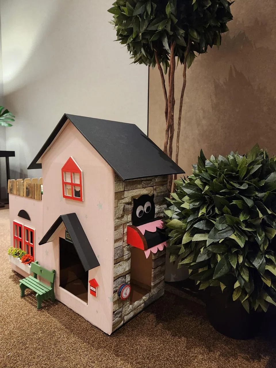 She cut out windows in the boxes and added planters and other fixtures.