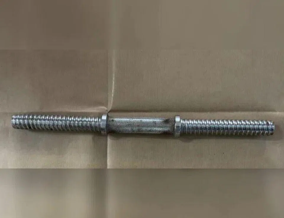 The metal rod that was seized as a case exhibit by police when the armed robbery suspect was arrested.