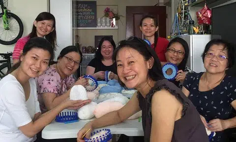 Rosalind (centre, back) and other volunteers at an Angel Gowns gathering. Photo: Rosalind Ang