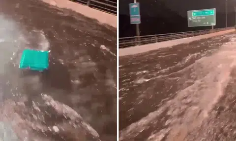 Car drives through floodwater on BKE caused by drain gratings clogged with silt and dead leaves