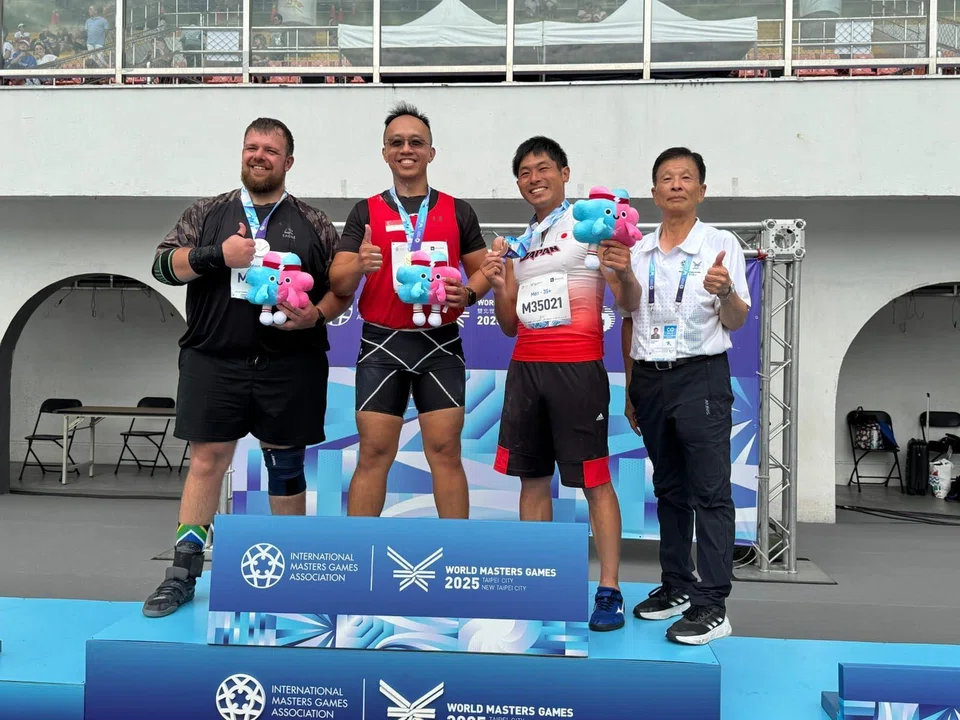 Toh WeiDe (second from left) claimed the discus and shot put 35+ titles at the World Masters Games.