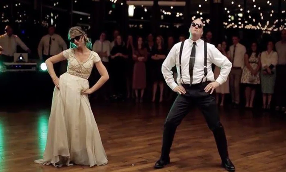Father and daughter surprise wedding guests with epic dance routine