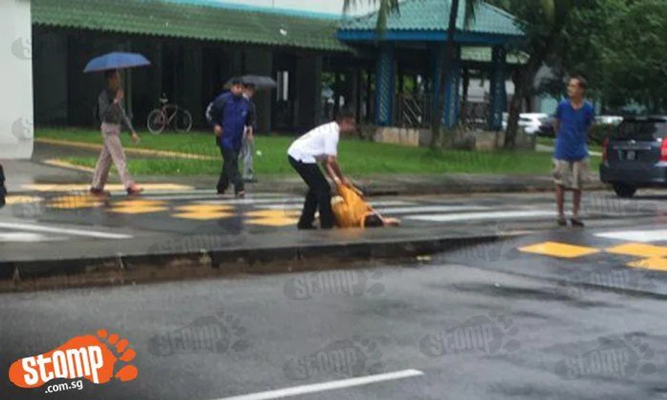 Cyclist injured after falling off bike while riding on slippery road in Toa Payoh