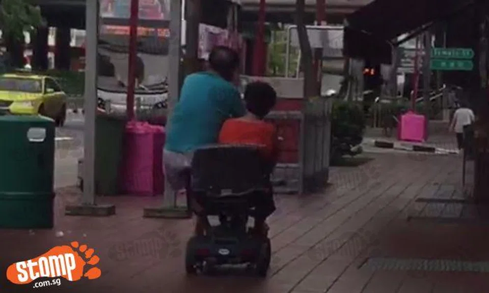 Isn't this dangerous? Uncle and auntie share a motorised wheelchair