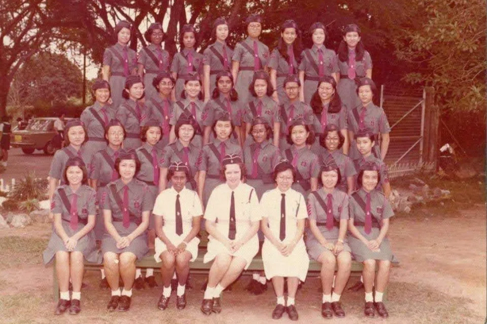 Mrs Claudette Poulier (centre) was the then captain of the Girls' Brigade's fourth company. Her former student Ang Hwee Suan was a 'proud member' of it and said of Mrs Poulier: 'Nobody would say they didn't love her.' PHOTO: COURTESY OF ANG HWEE SUAN