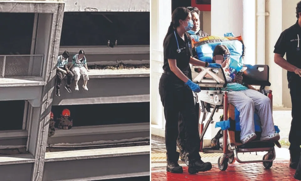 two girls sitting on seventh storey carpark ledge in toa payoh