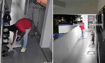 The man picked a pair of slippers and walked to the end of the corridor, placed them on the ground and fiddled with his phone.