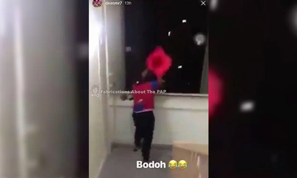 Guy throws traffic cone from upper storey of HDB block