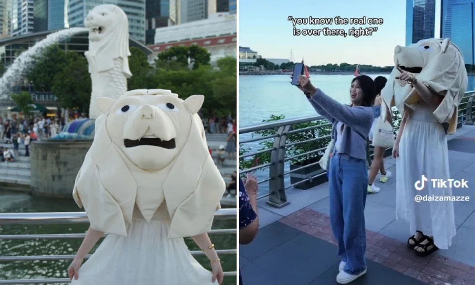 TikToker Daisy Anne Mitchell posted a video of herself in a large pale lion's head and a white dress getting her pictures taken with people and generally cutting it up.