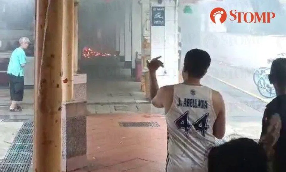 Stomper Viktor shared a video showing bystanders under a shelter watching the flames as rain fell outside.