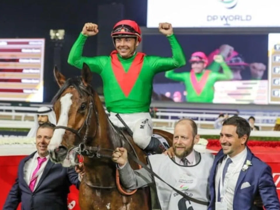 Facteur Cheval (Maxime Guyon) at the winner's circle with trainer Jerome Reynier (second from right) and connections in Meydan after gaining his most prestigious reward in the Group 1 Dubai Turf (1,800m) on March 30.

