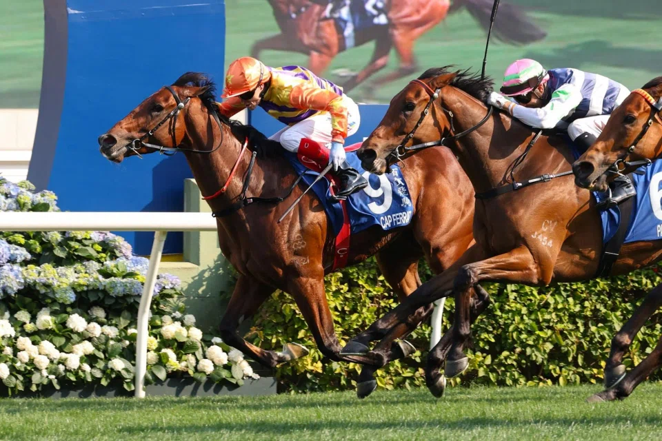 Cap Ferrat (Craig Williams) holding off Packing Angel (Joao Moreira) to post his first career win in the BMW Hong Kong Derby (2,000m) on March 23.