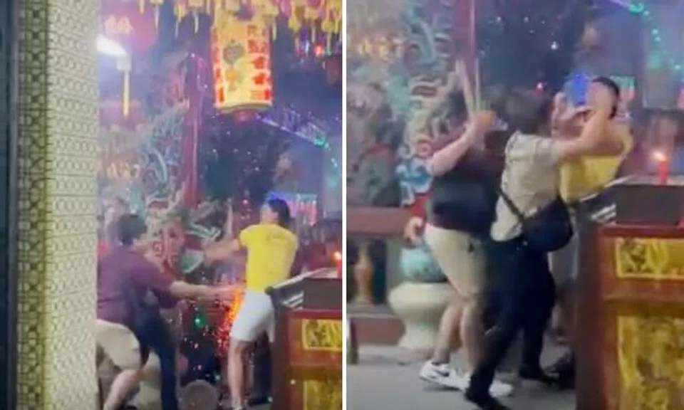 Man with burning incense sticks falls after rushing into temple and punches volunteer, leading to scuffle 