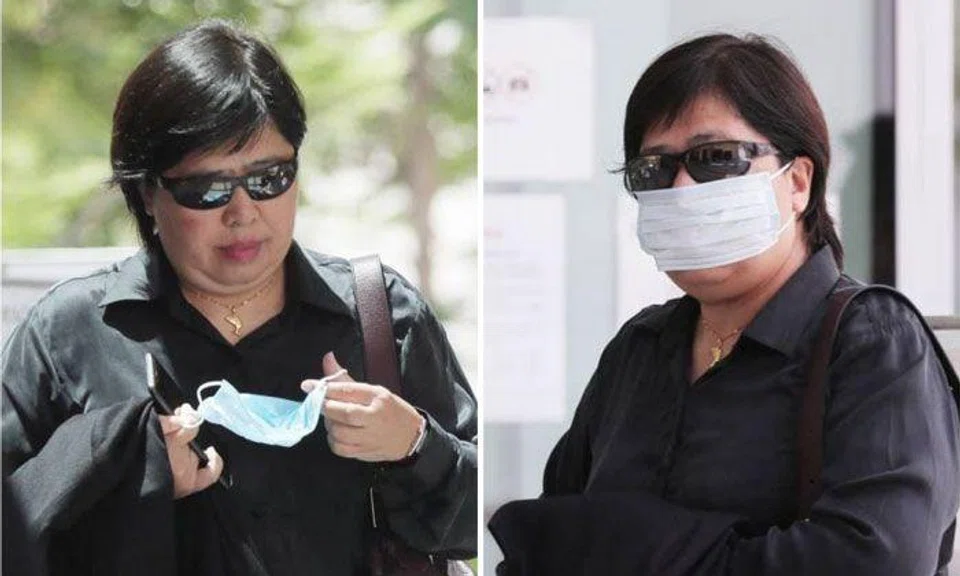 Phoon Chiu Yoke was wearing sunglasses as she approached the building, and only put a mask on as she neared the entrance. ST PHOTO: KELVIN CHNG