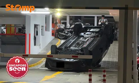 car overturned at woodlands carpark