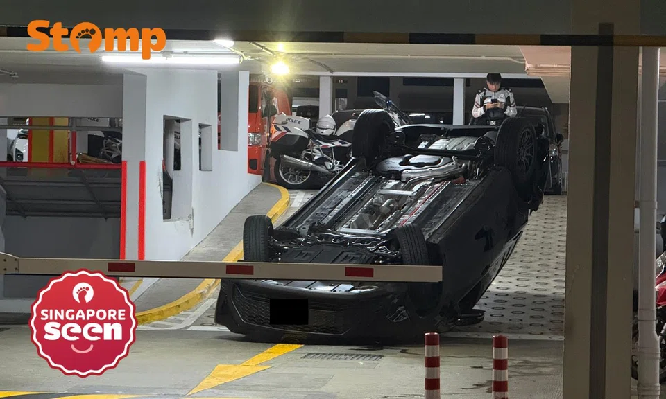 car overturned at woodlands carpark