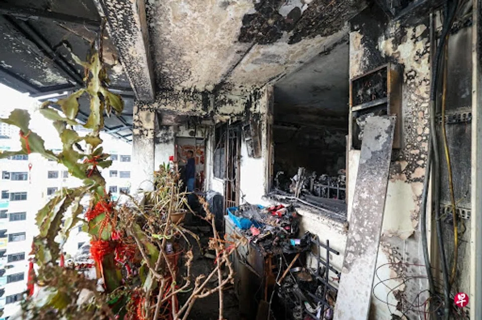 The fire-damaged corridor of a HDB block
