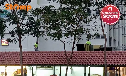 Man working on a ledge in Bedok North