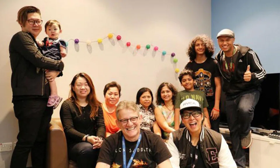 The Flying Dutchman and Glenn Ong (front row) and Andre Hoeden (right) with the two families and their maids. PHOTO: ONE FM 91.3