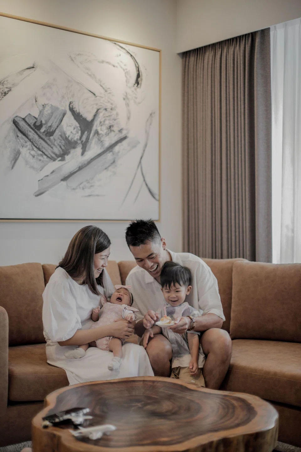 Ms Goh Xin Lei and Mr Adrian Ang with their children Natalie and Zachary in their third home.
