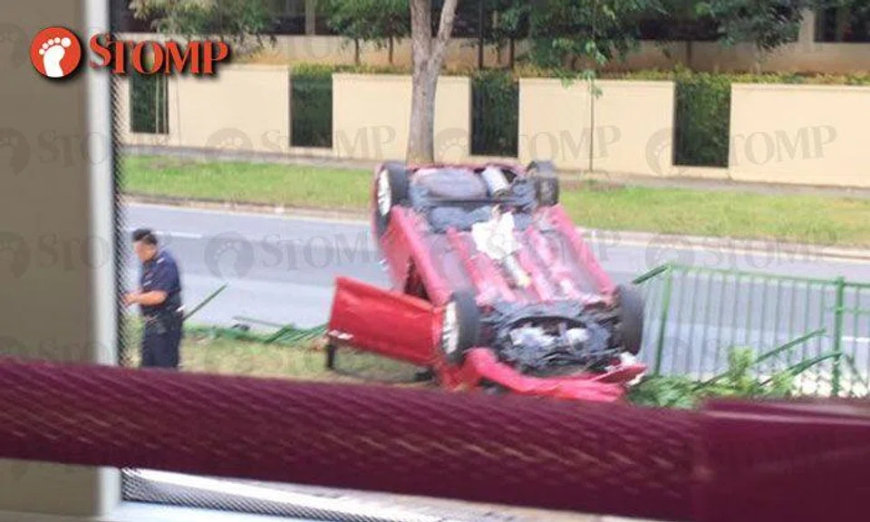 Car turns turtle along Buangkok Drive during morning peak hour