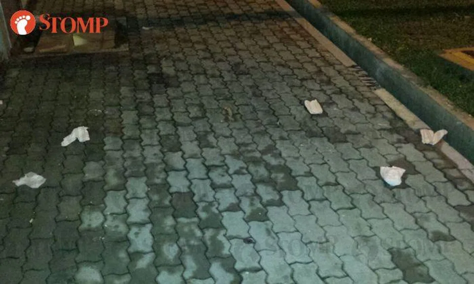 Gross! Several soiled sanitary pads thrown from kitchen window at Blk 313 Hougang Ave 5