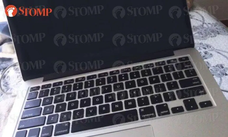 Woman looking for MacBook Pro at Bugis Junction’s toilet