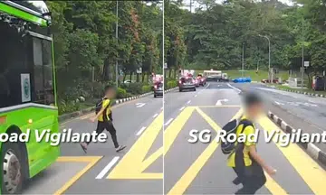 Boy sprints from behind bus and almost gets knocked down by oncoming vehicle
