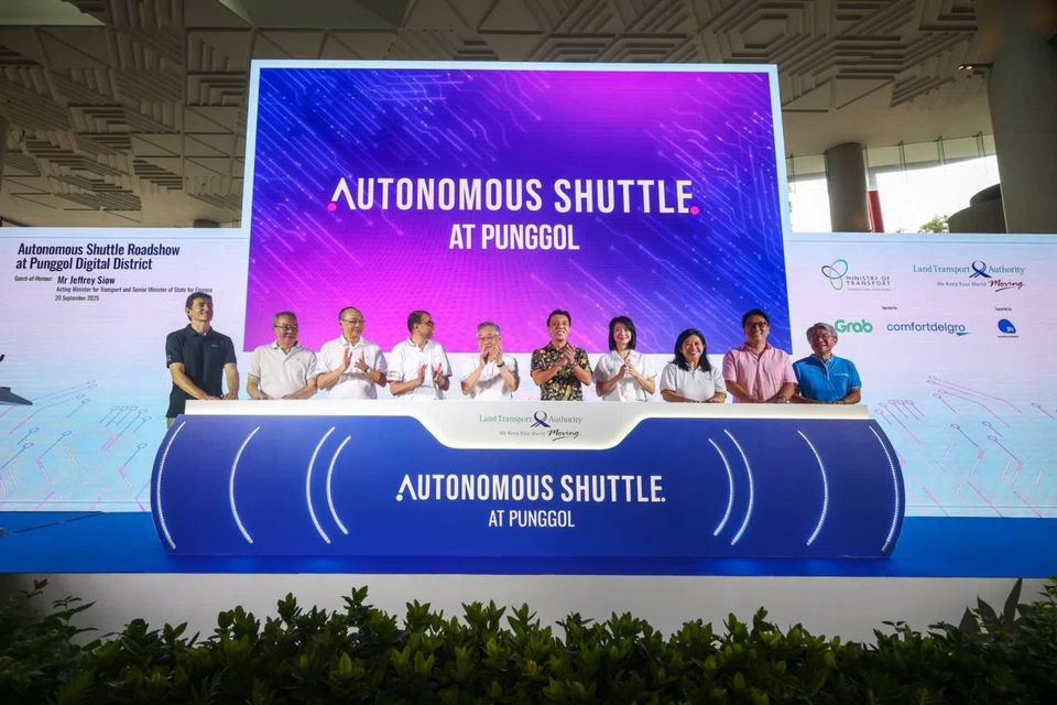 Acting Transport Minister Jeffrey Siow (fifth from right) said the aim is to bring in 10 self-driving vehicles by the end of 2025, and possibly 100 to 150 by the end of 2026.