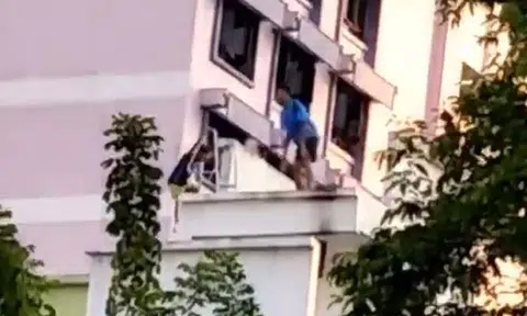 Kids goof around on ledge of HDB block, oblivious to the danger they face