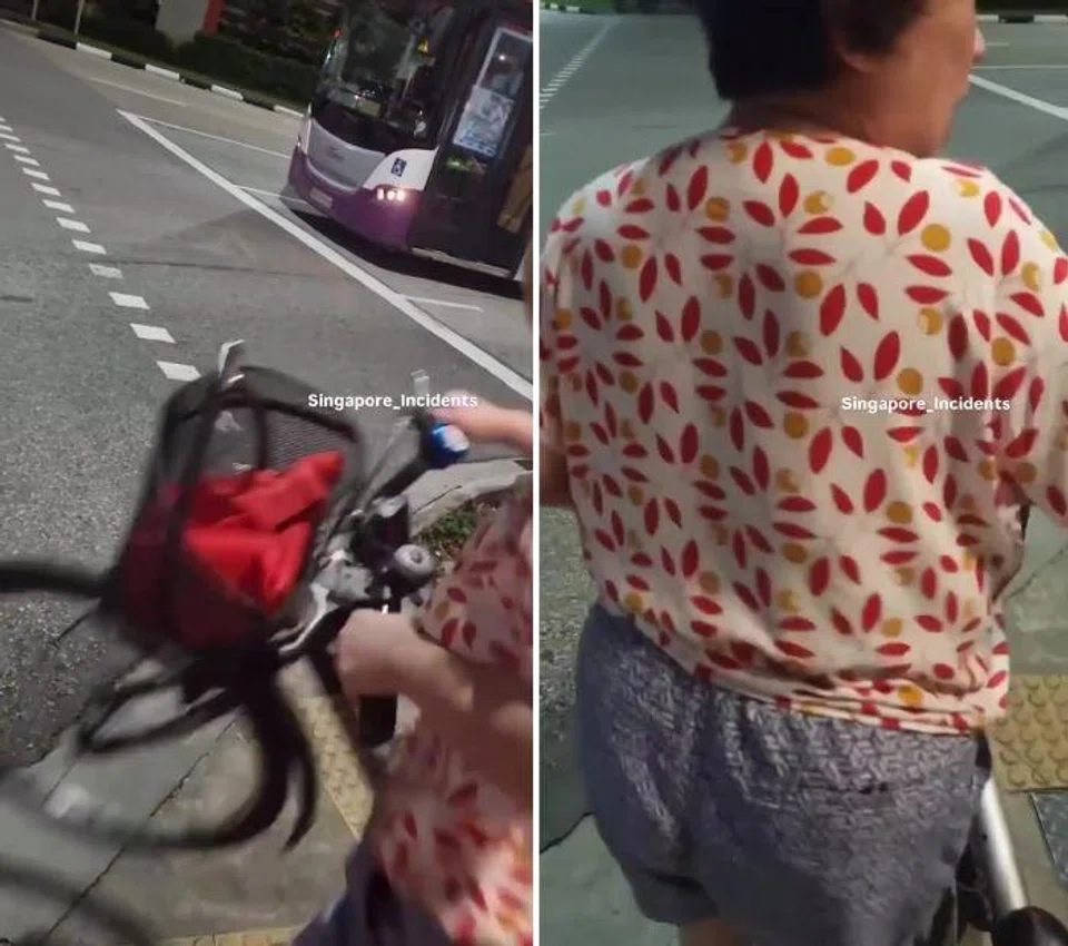 The woman lifted it and banged it down on the ground in front of the video-taker in a threatening manner.