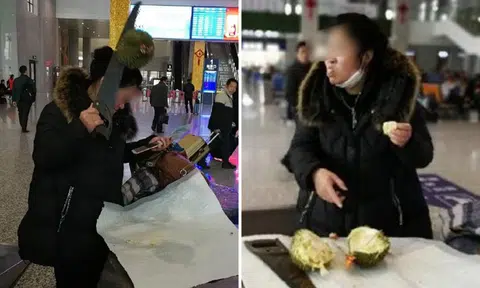 Chinese woman hacks open durian with saw and eats it on the spot after being denied entry on train