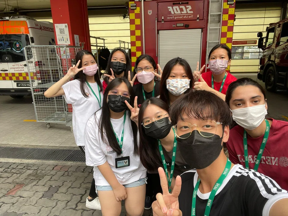 Mr Lee (front) with his ITE classmates at the one-day SCDF course that he organised during the school holidays.