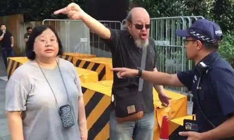 Uncle and auntie shout at police officer -- who handles it calmly like a pro