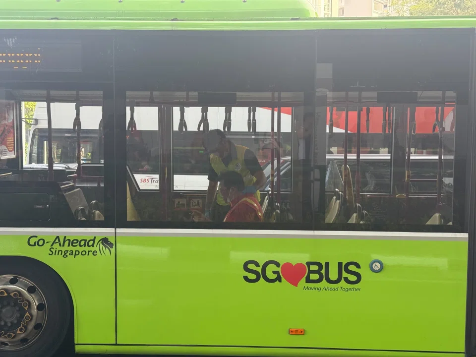 The bus driver being treated on the bus after the accident.