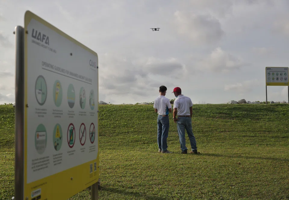 Hobbyists flying a drone at the Unmanned Aircraft Flying Area at Pandan Reservoir in July 2022.