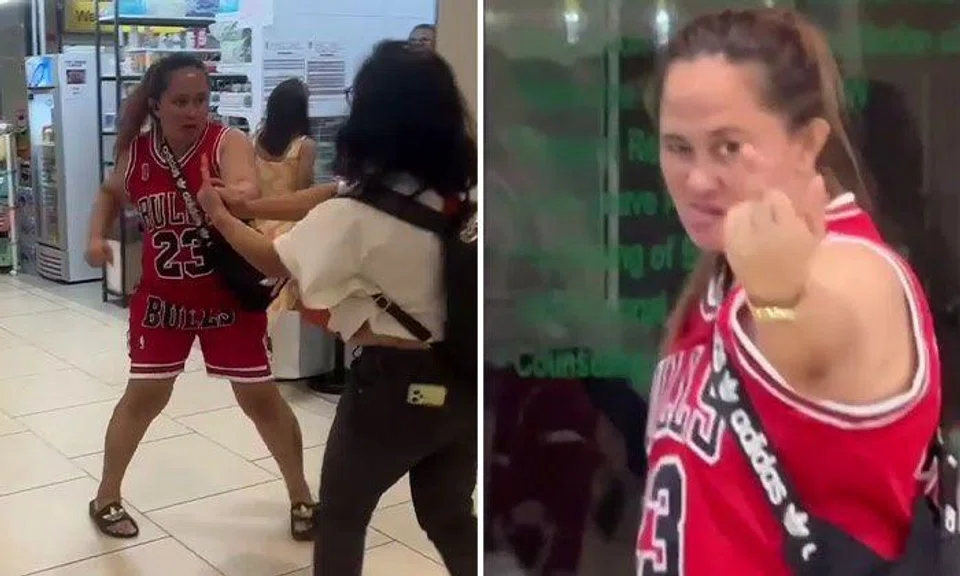 Woman throws punches and points middle finger in dispute at Lucky Plaza