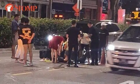 A Stomper shared a video of the aftermath of the accident, showing people gathered around someone lying in the middle of the road near an Esso petrol station.