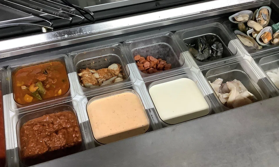 The lapses include improper segregation of raw and cooked food at the serving station.